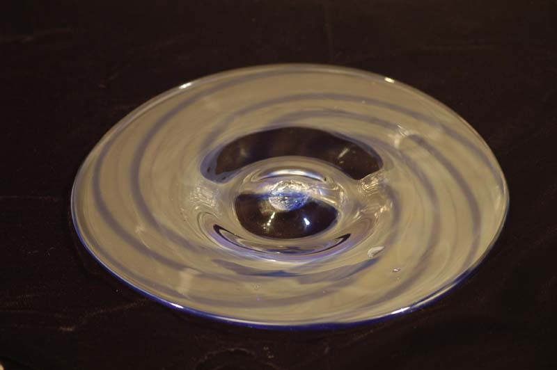 A plate - spun at the end to make it flat